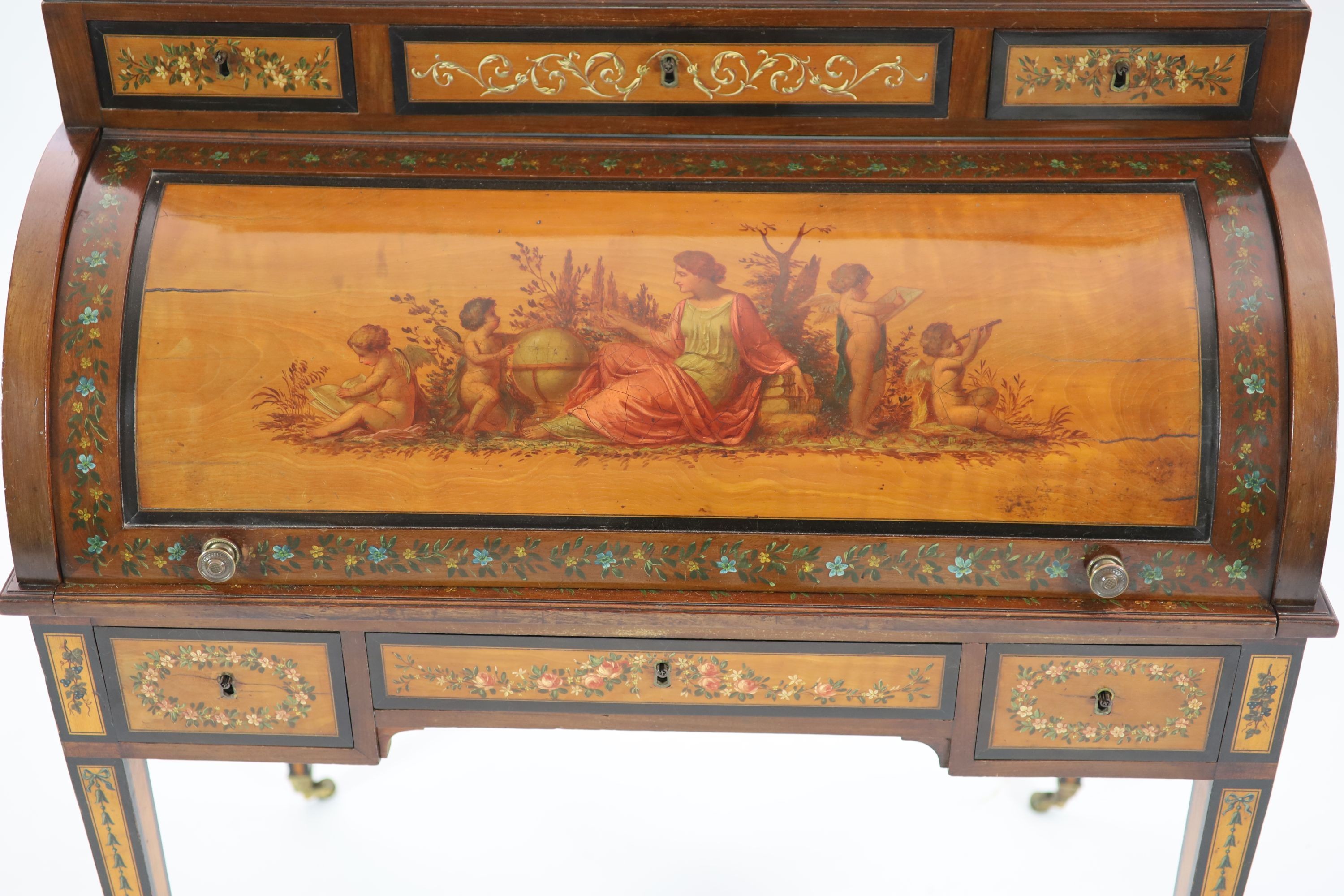 An Edwardian Sheraton Revival painted satinwood cylinder bureau / bonheur du jour H 162cm. W 97cm. D 58cm.